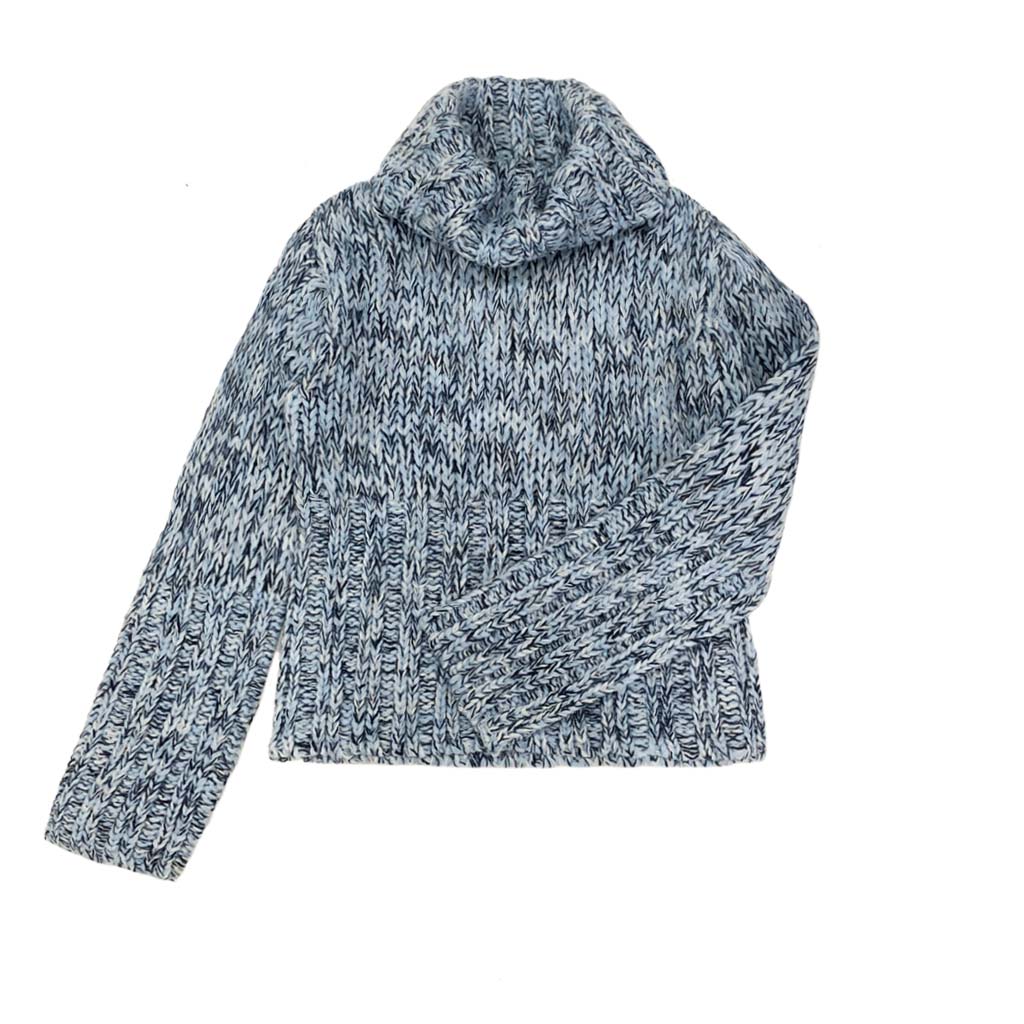 Soft-touch long sleeve turtleneck offering wool-like comfort and appearance.
