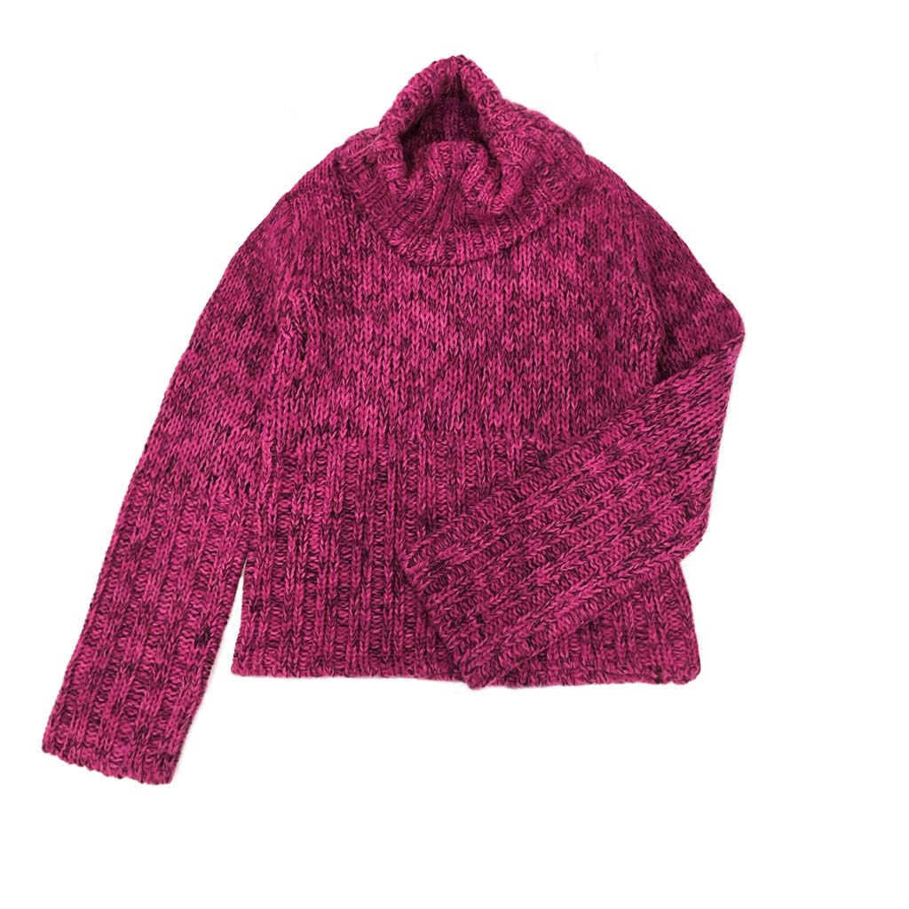 Soft-touch long sleeve turtleneck offering wool-like comfort and appearance.