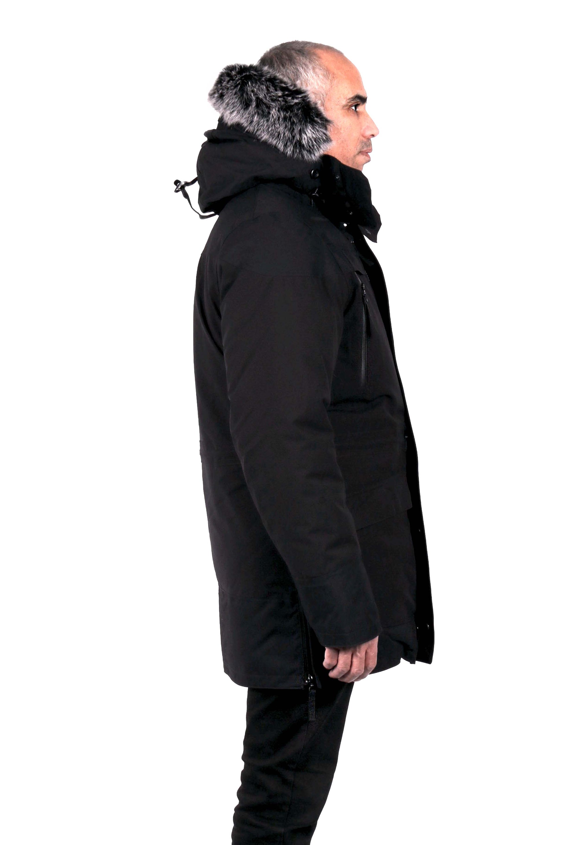 Durable men's parka designed for peak winter performance. Water resistant shell, wind stopper panel, detachable faux fur hood, quilted fleece lining, adjustable cuffs, YKK zipper, functional pockets.